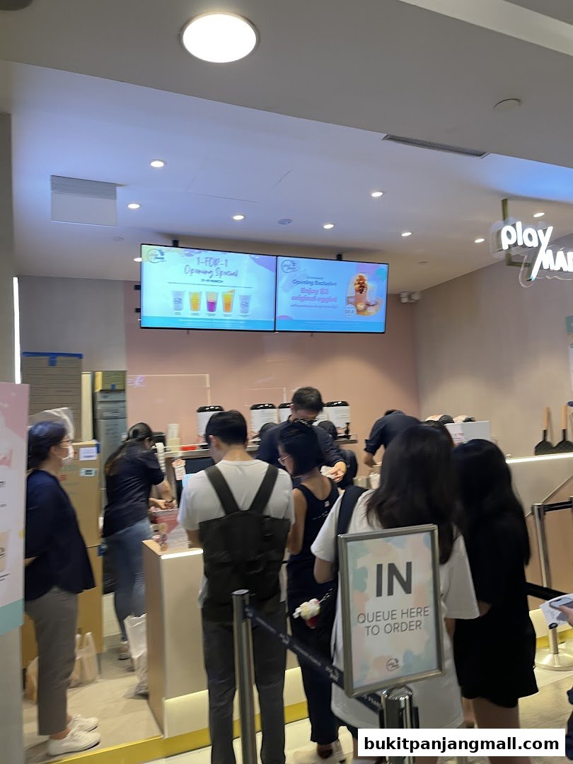 Customers queue at PlayMade Bukit Panjang Plaza for opening specials.