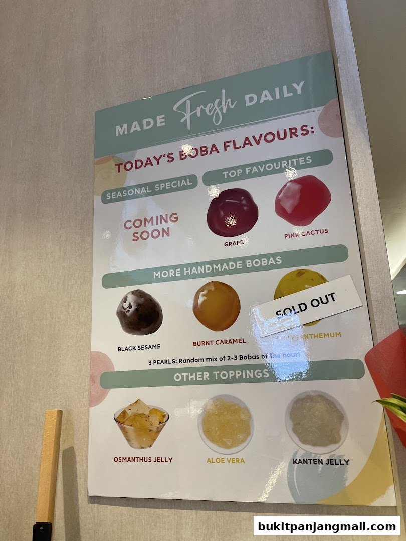 A menu board showcasing today's boba flavors and other toppings.