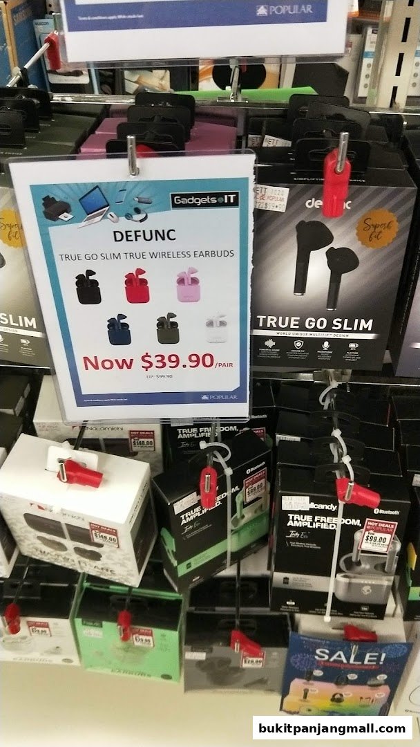 A display of wireless earbuds and other electronic accessories at POPULAR Bookstore.