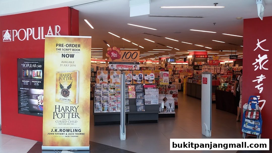 The entrance to POPULAR Bookstore, featuring a Harry Potter book promotion and various in-store deals.