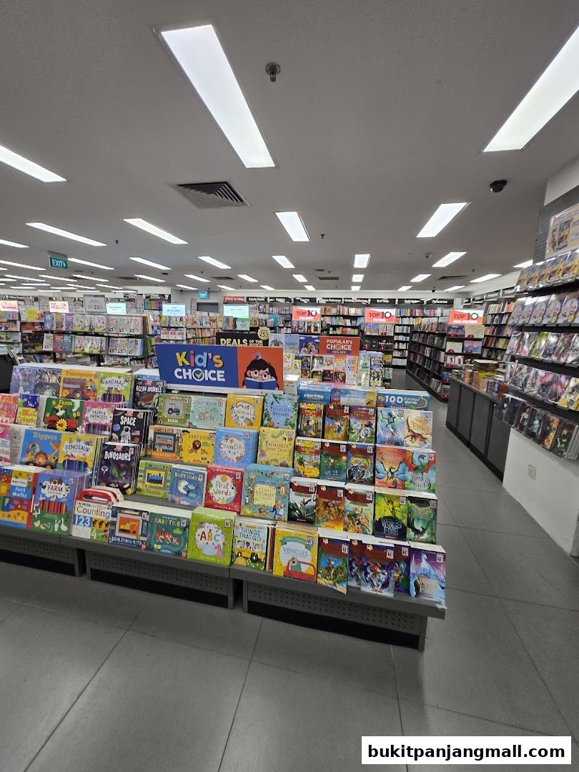Interior view of a Popular Bookstore with shelves full of books, focusing on children's books.