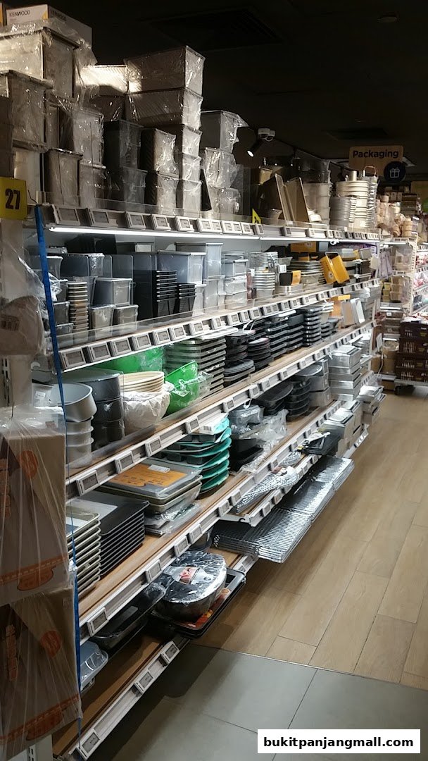 Shelves stocked with baking pans, containers, and kitchenware at RedMan by Phoon Huat.