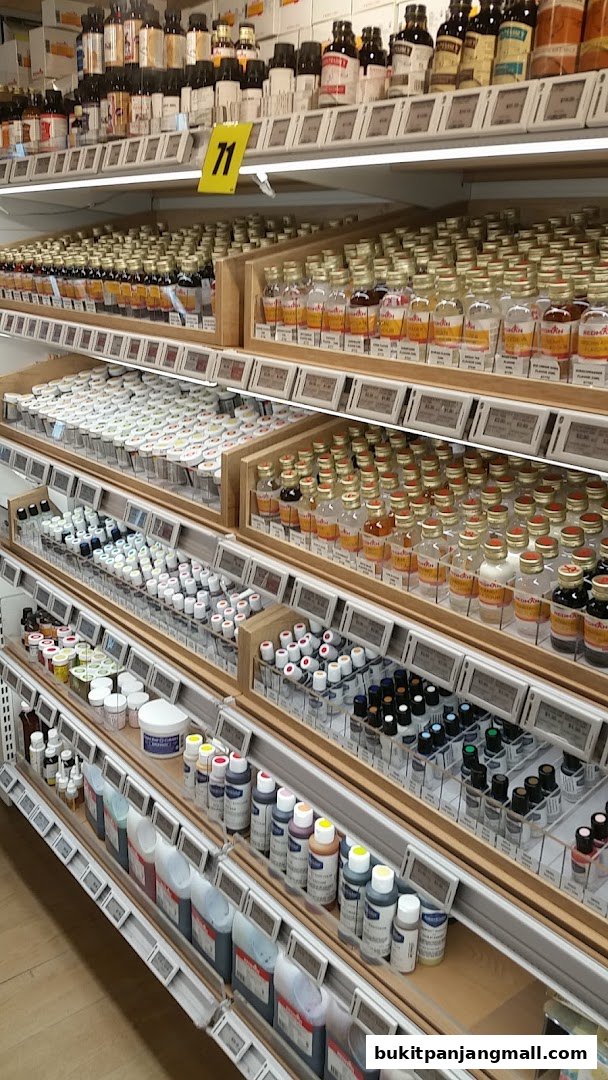 Shelves stocked with various baking ingredients like flavorings, food coloring, and extracts.