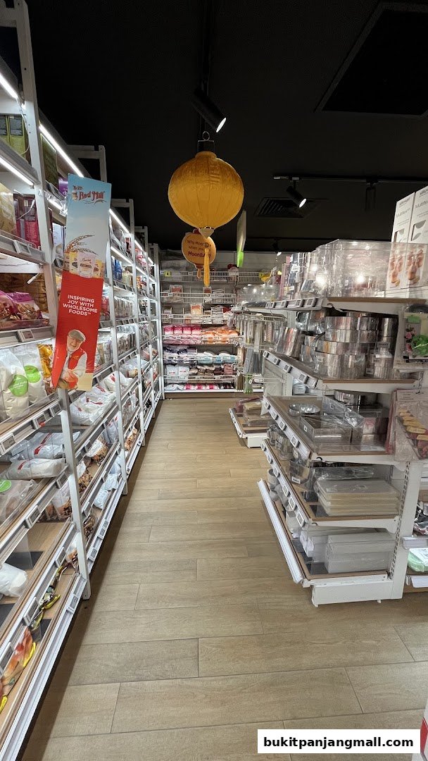 Aisle view of a RedMan by Phoon Huat store, showcasing shelves stocked with baking supplies and ingredients.