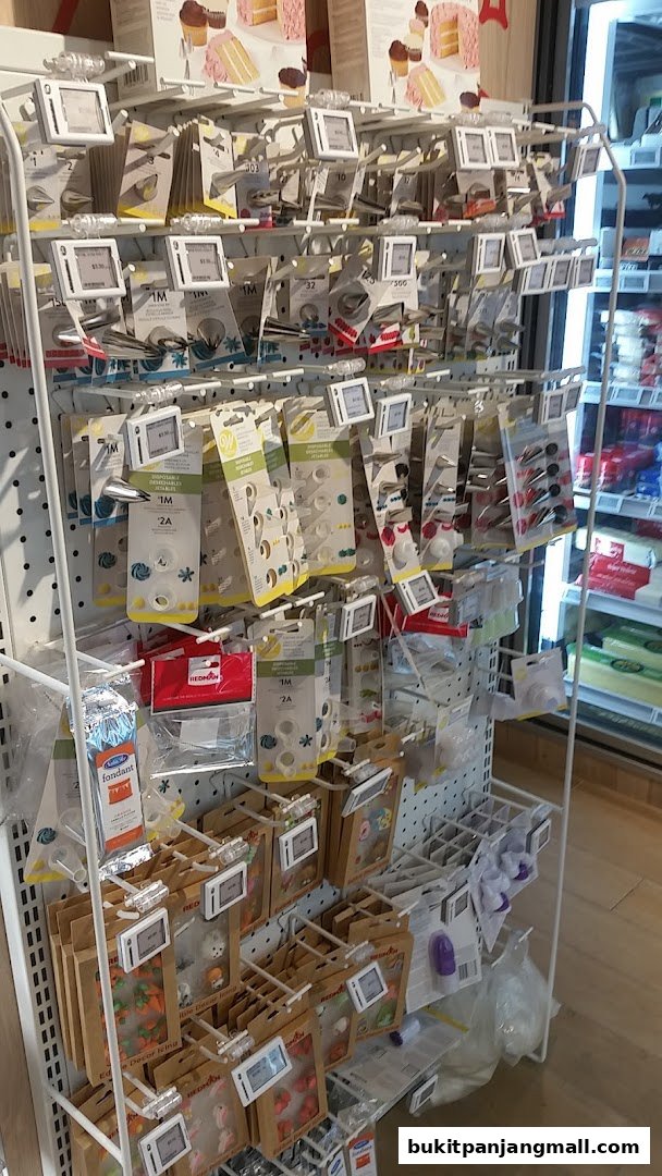 A display rack filled with various baking and cake decorating supplies.