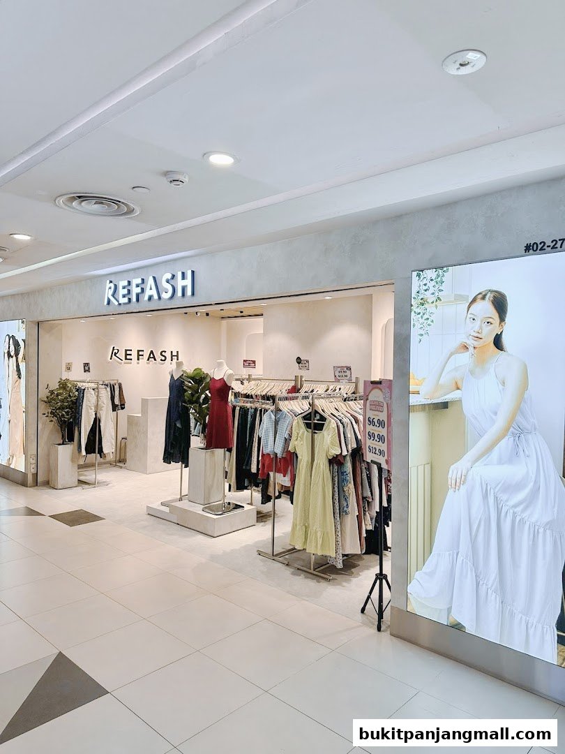 The entrance of a REFASH store displaying various clothing items on racks and mannequins.