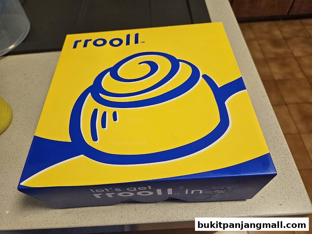 A bright yellow box with blue lettering and a swirl design, likely for baked goods.