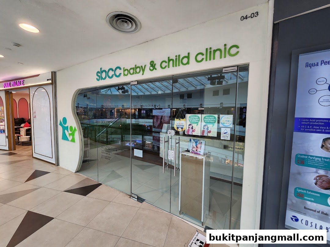 The exterior of SBCC Baby & Child Clinic, a modern clinic with glass doors and signage.