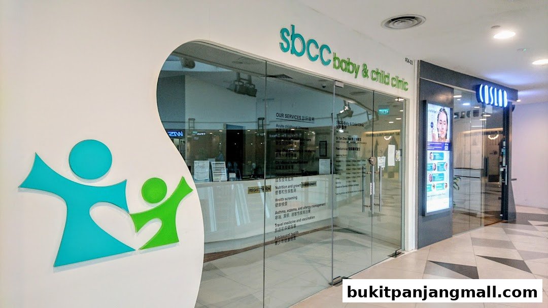 The entrance of SBCC Baby & Child Clinic with its logo and services listed on the glass.