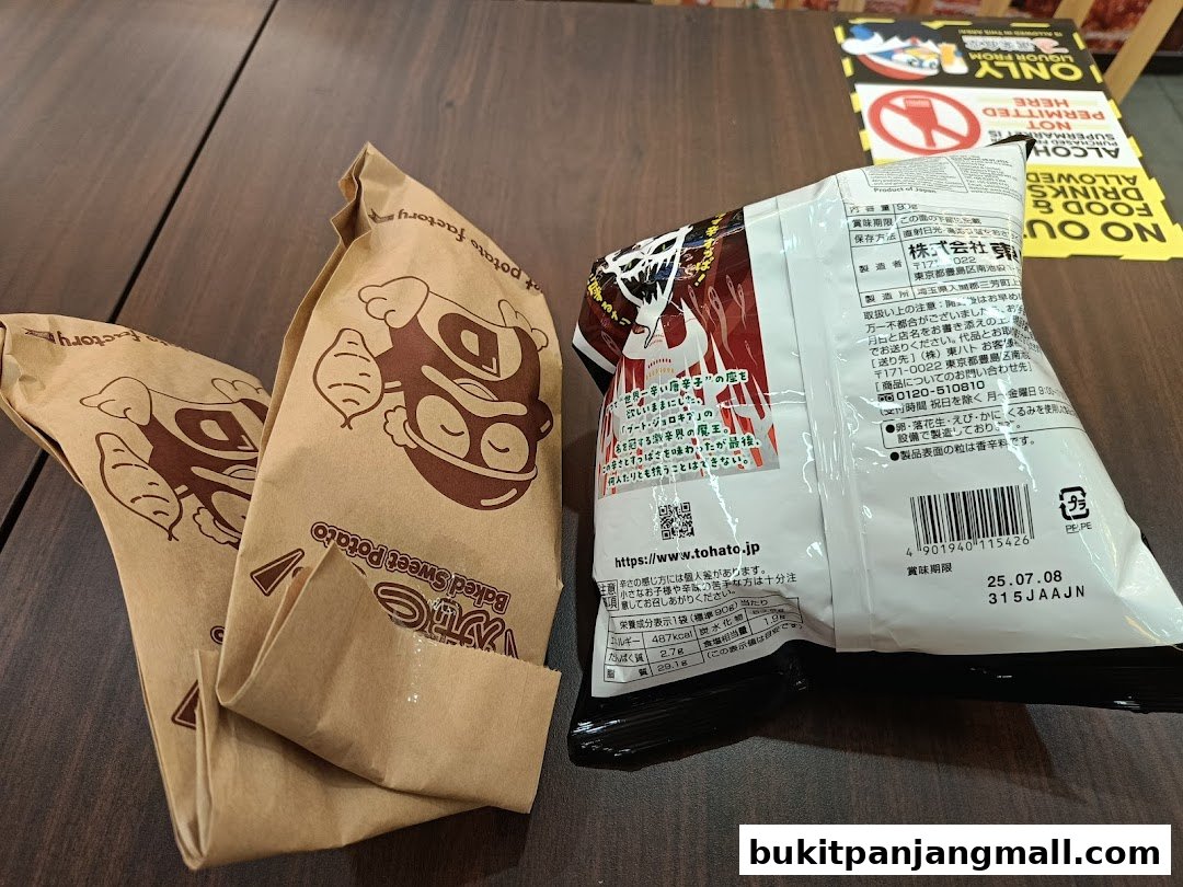 Two brown paper bags with a cartoon potato character and a bag of chips on a wooden table.