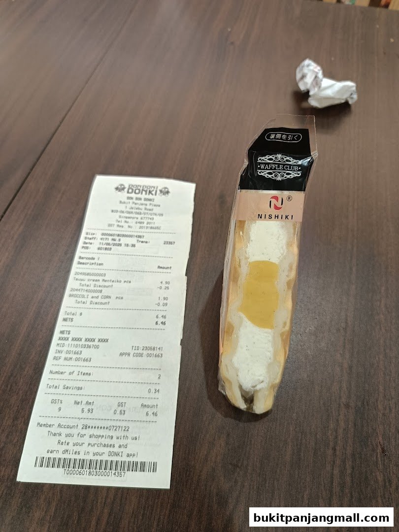 A receipt and a packaged dessert item from Don Don Donki.