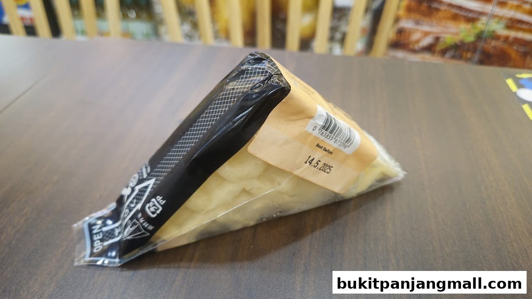 A triangular packaged food item with a best before date of 14.5.2025.