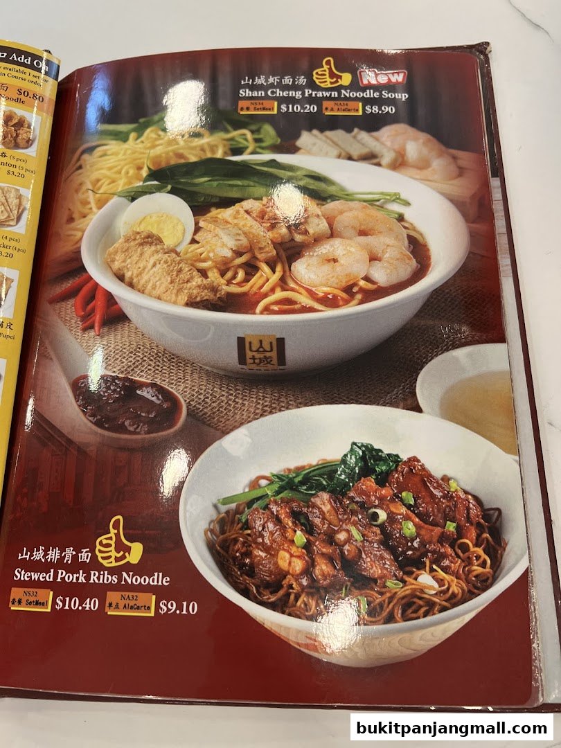 A menu page showcasing two popular noodle dishes from Shan Cheng Ipoh Delicacies.