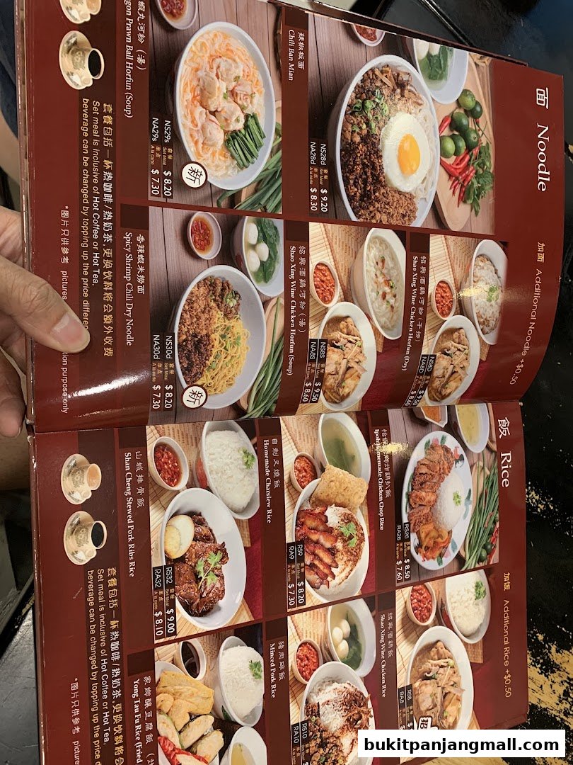 A menu from Shan Cheng Ipoh Delicacies featuring various noodle and rice dishes with prices.