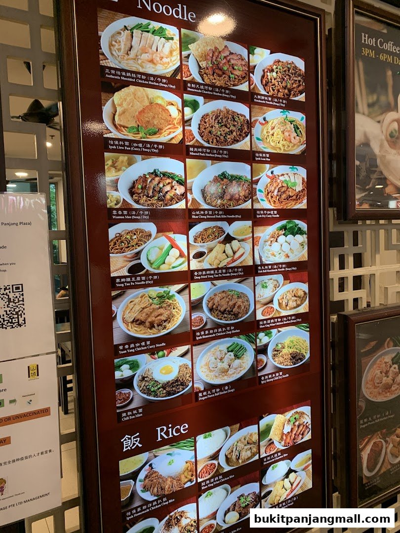 A menu board displaying various noodle and rice dishes with images and descriptions.