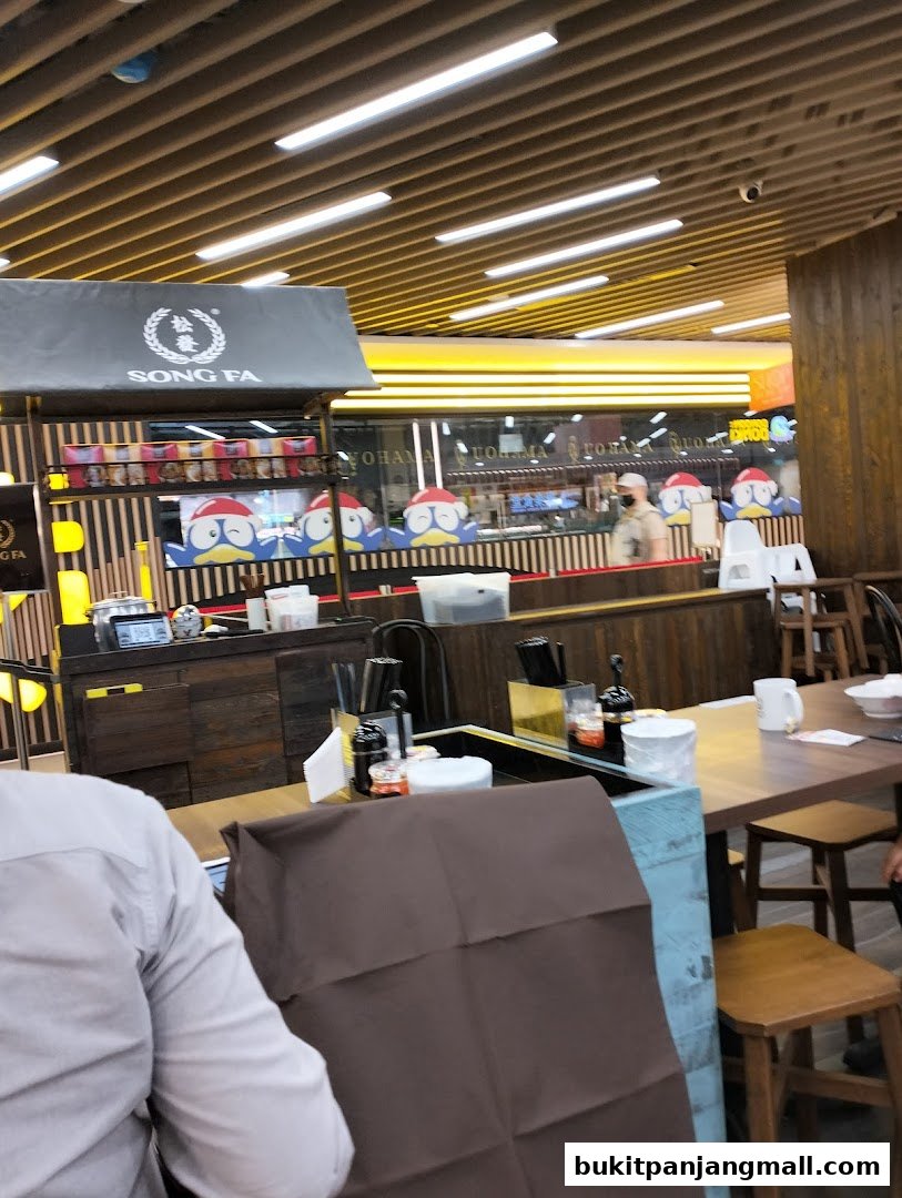 Interior view of Song Fa Bak Kut Teh restaurant with seating and counter.