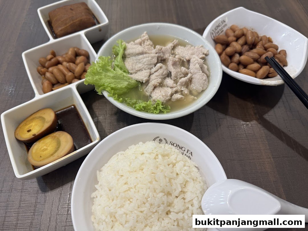 A delicious spread of Song Fa Bak Kut Teh dishes including pork ribs soup, braised peanuts, eggs, and rice.