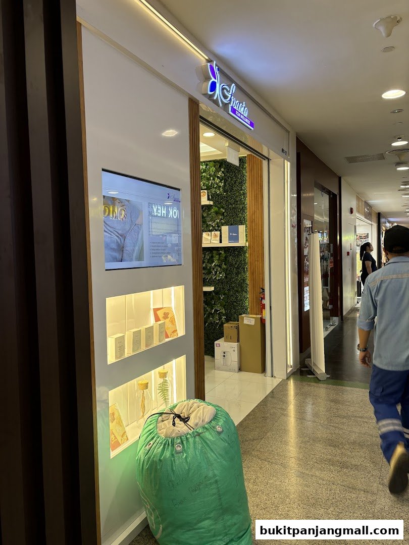 The entrance of Spacio TCM Wellness shop with products displayed in a lit display case.