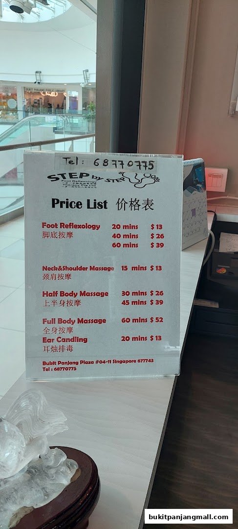 A price list for Step by Step massage services, including foot reflexology and full body massage.