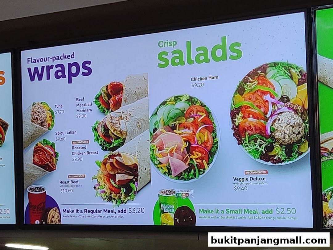 A Subway menu board displaying wraps and salads with prices and images.