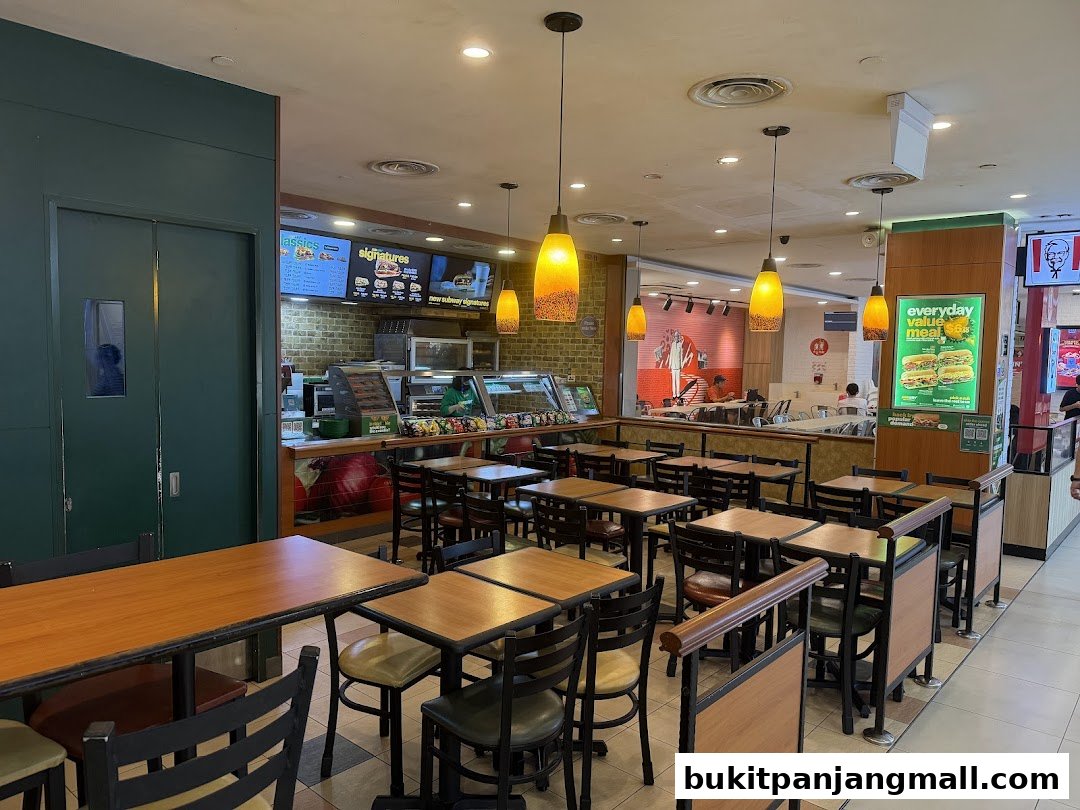 Interior view of a Subway restaurant with seating and a service counter.