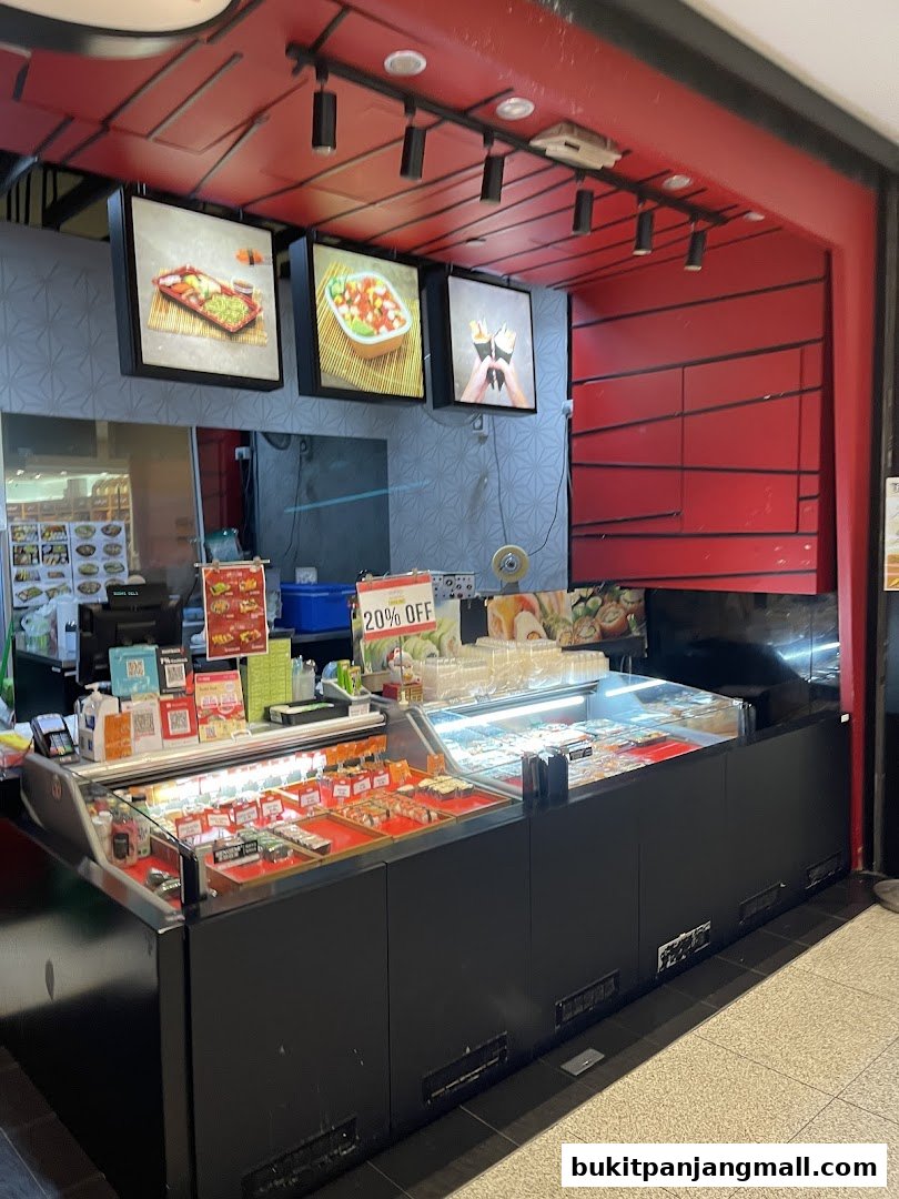 A Sushi Deli counter displaying various sushi rolls and bento boxes with a 20% off sign.