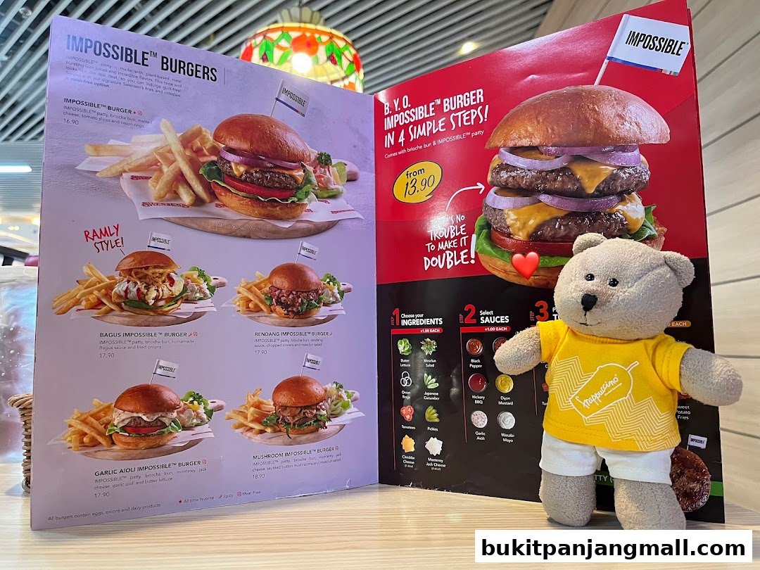 A menu showcasing various Impossible burgers with descriptions and prices, alongside a teddy bear.
