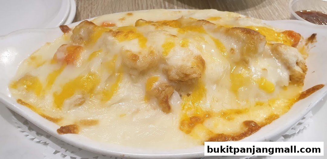 A close-up of a creamy baked dish topped with melted cheese and golden-brown crust.