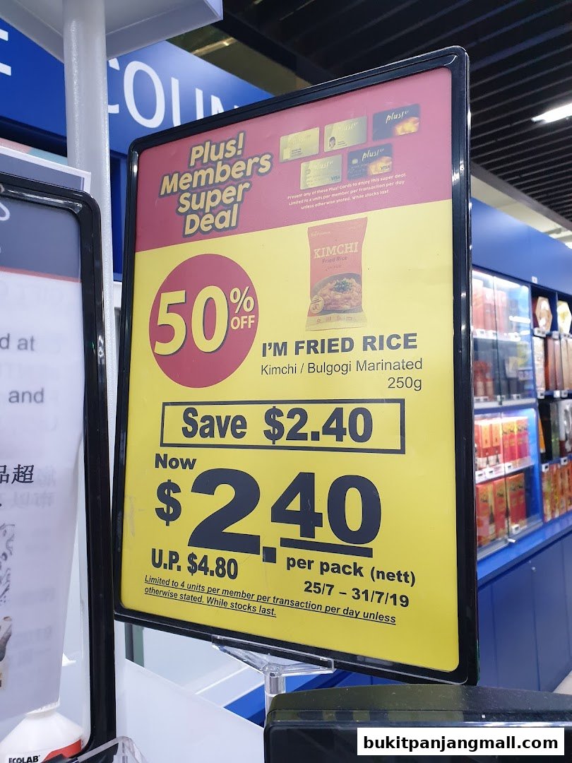 A promotional sign for 'I'm Fried Rice' offering a 50% discount for Plus! Members.