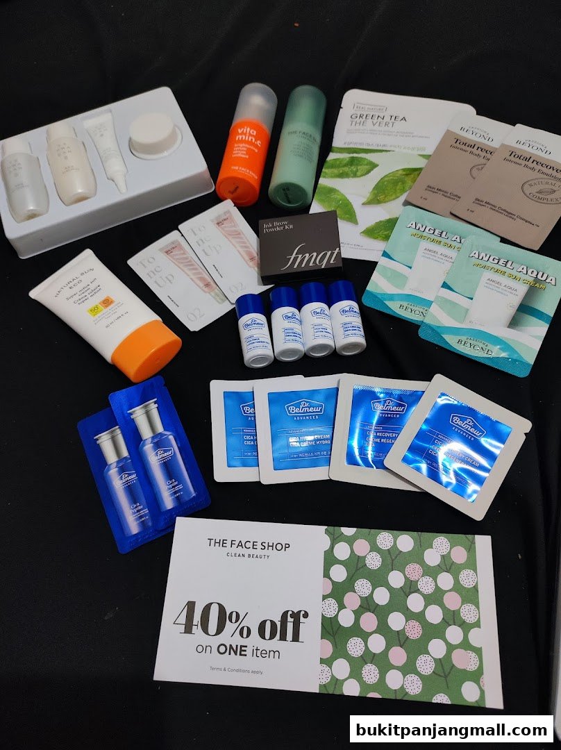 A collection of skincare products and samples from THEFACESHOP, including serums, creams, and sunscreens.