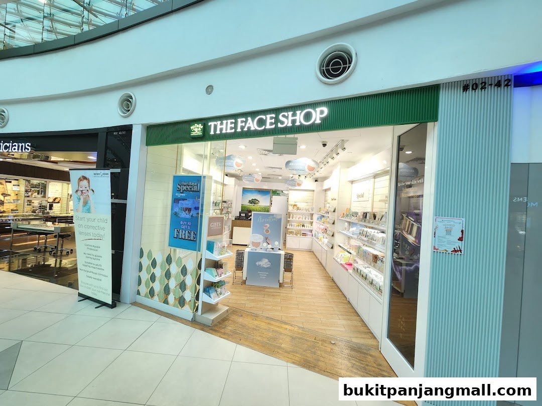 The entrance of THEFACESHOP store, showcasing various skincare products and promotions.