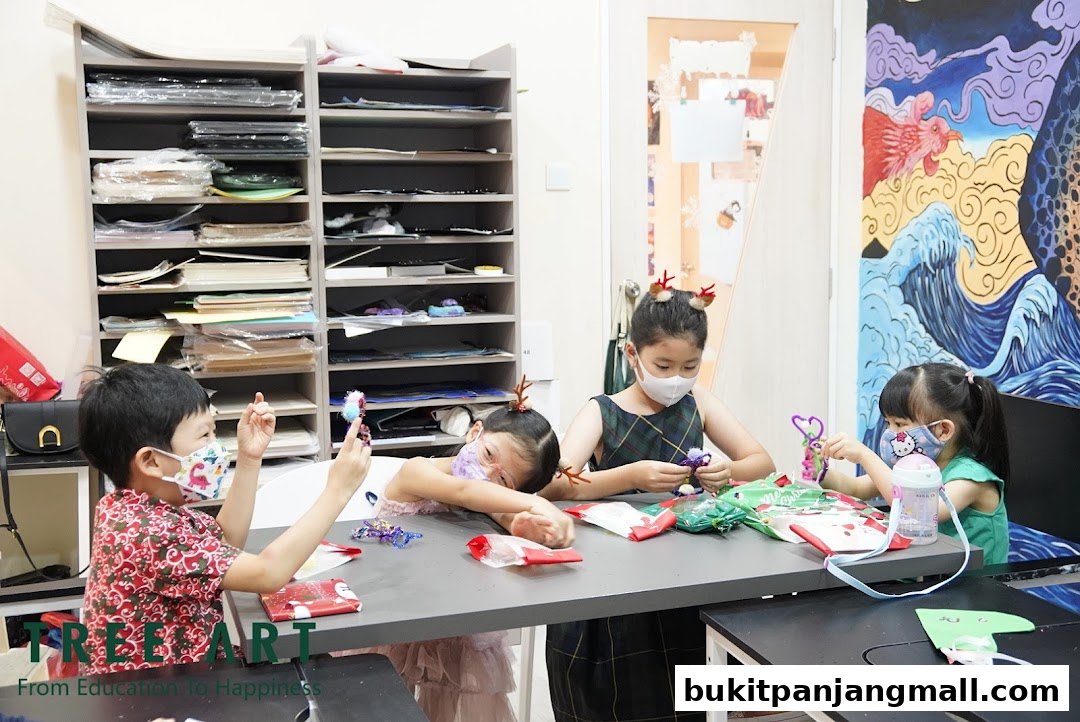 Children engaged in an art and craft activity at Tree Art.