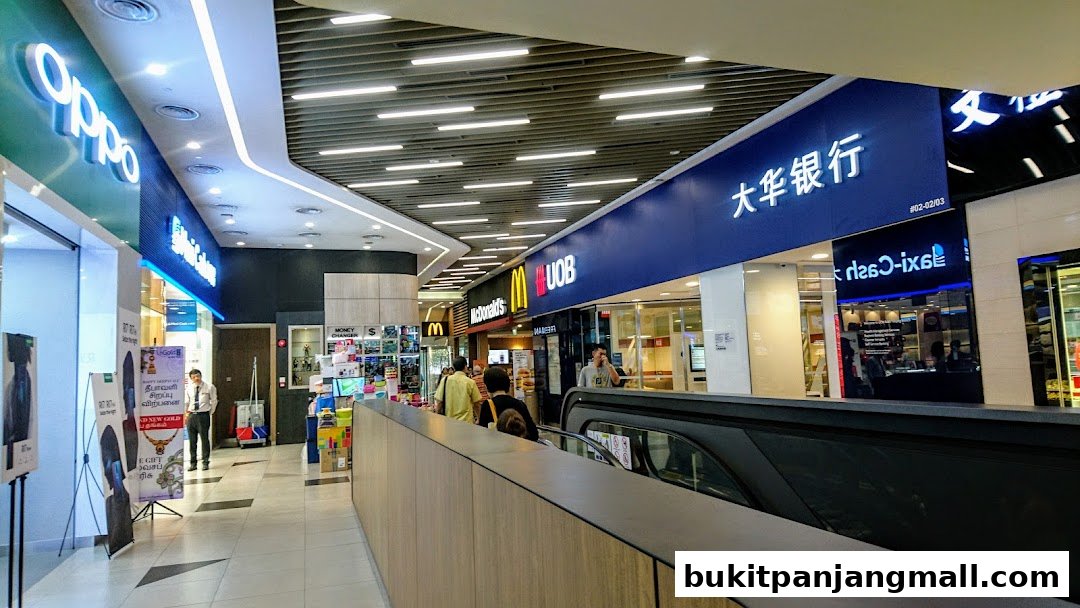 A shopping mall corridor with various shops including UOB Bank, McDonald's, and Oppo.