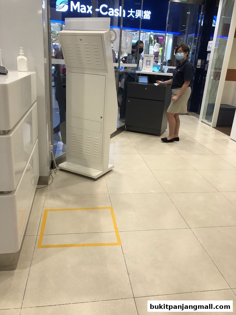 A bank branch interior with a customer service representative assisting a customer.