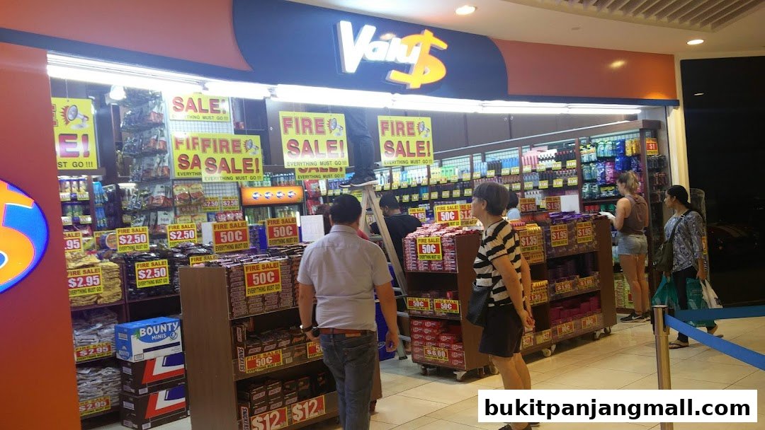 A retail store called Valu with a large 'Fire Sale' promotion and various products displayed.