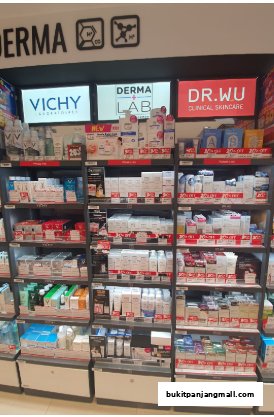 Shelves stocked with various skincare products from brands like Vichy and Dr. Wu.
