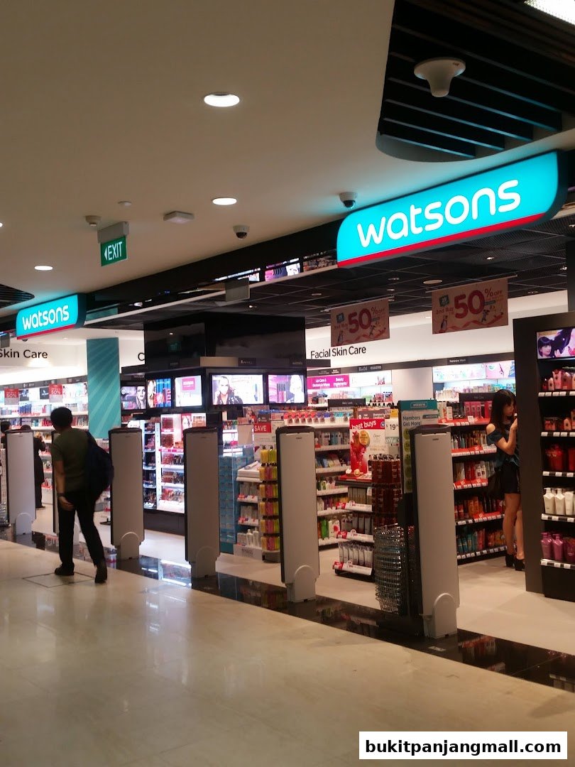 Interior view of a Watsons store with bright signage and shelves stocked with products.
