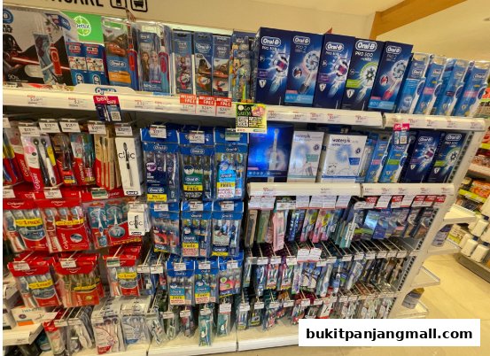Shelves stocked with various oral hygiene products, primarily toothbrushes and toothpaste.