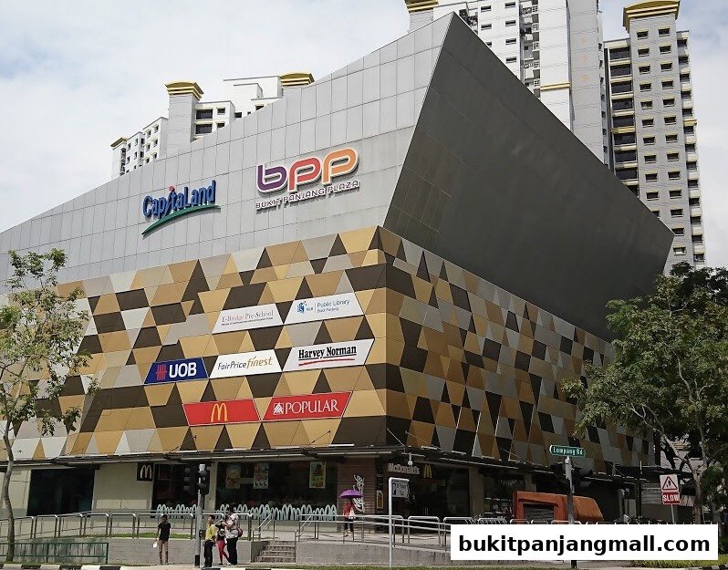 Exterior view of Bukit Panjang Plaza mall with various retail store signs visible.