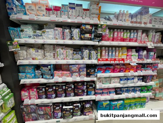 Shelves stocked with various personal care and sanitary products, including pads and lotions.