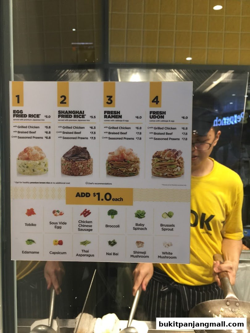 A menu board for Wok Hey featuring fried rice, ramen, and udon dishes with various protein options.
