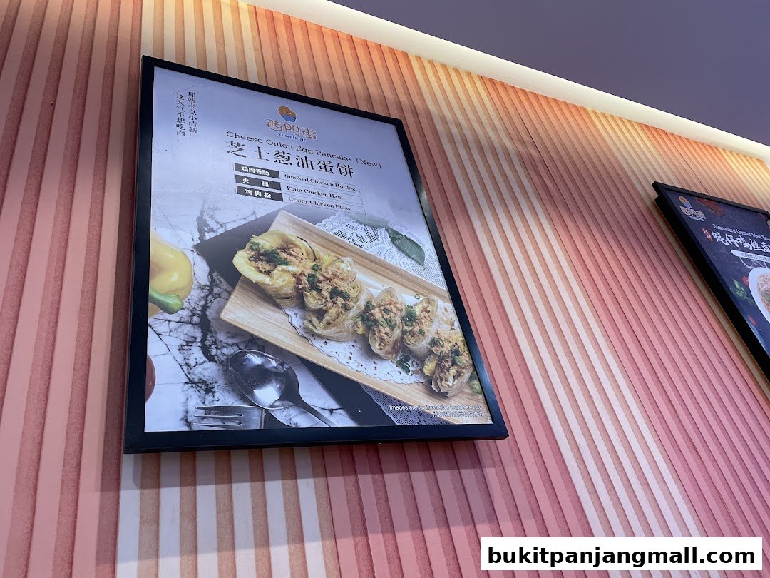A menu board displays a Taiwanese dish called Cheese Onion Egg Pancake with various filling options.
