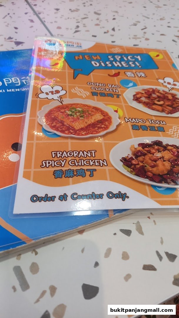 A menu featuring new spicy dishes from Xi Men Jie, including Gong Bao Chicken and Mapo Tofu.