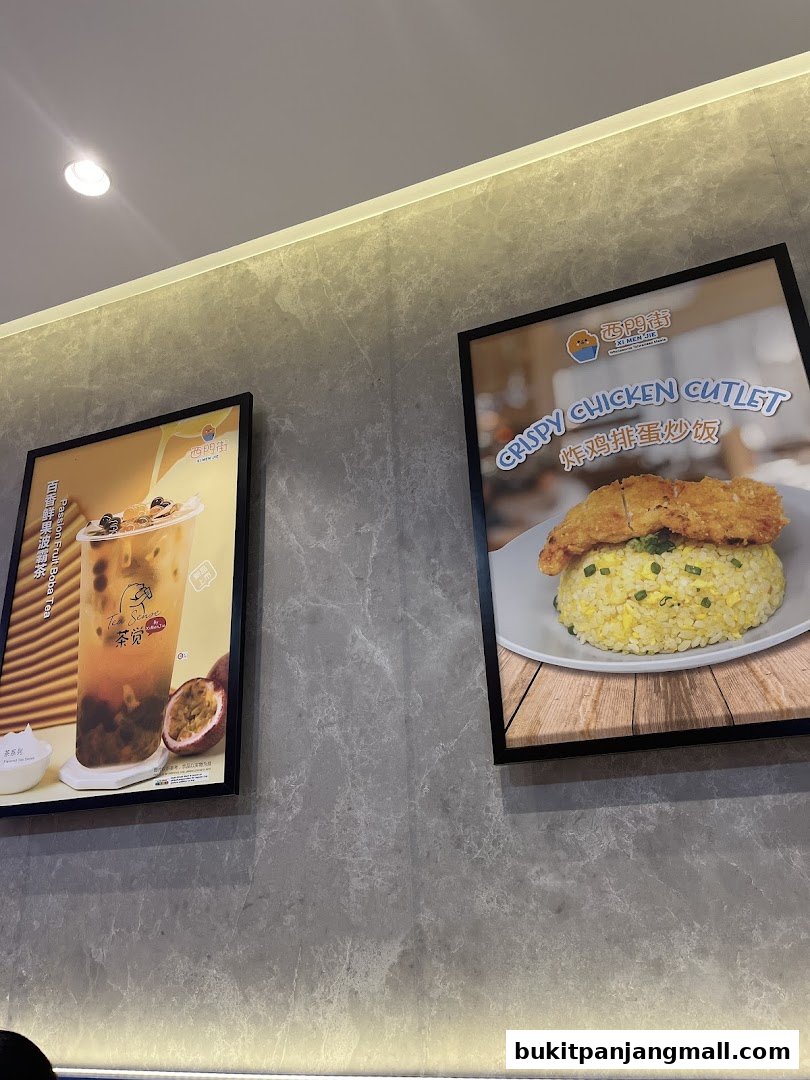 Two framed posters showcasing Taiwanese food and drinks, including bubble tea and crispy chicken cutlet with fried rice.