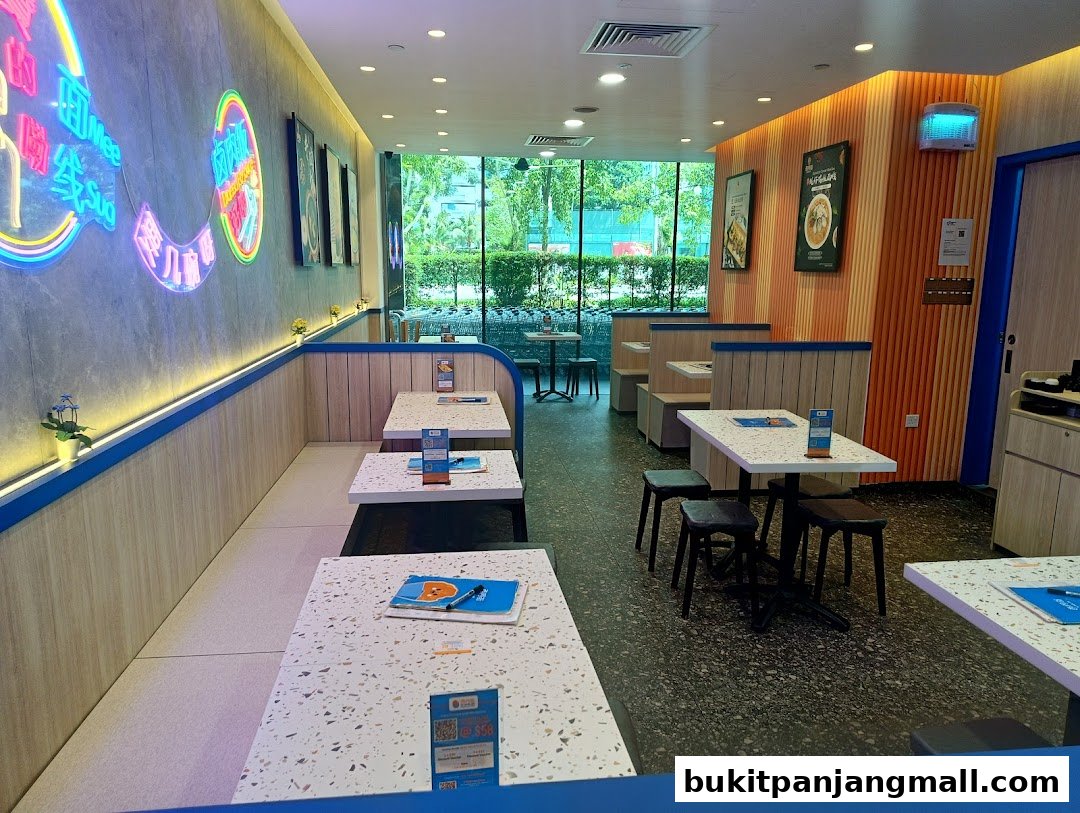 Interior view of a modern Taiwanese restaurant with neon signs and comfortable seating.