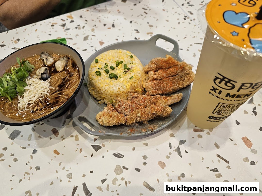 A Taiwanese meal featuring oyster noodles, fried chicken, fried rice, and a drink.