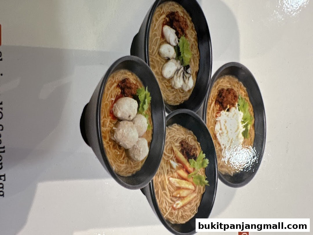 A close-up of four bowls of Taiwanese noodles with different toppings.