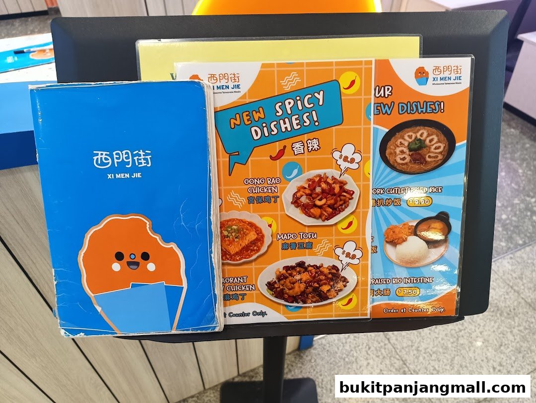 A display board showcasing new spicy Taiwanese dishes from Xi Men Jie.