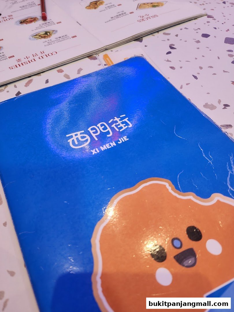 A blue menu cover with 'Xi Men Jie' logo and a cute cartoon character.