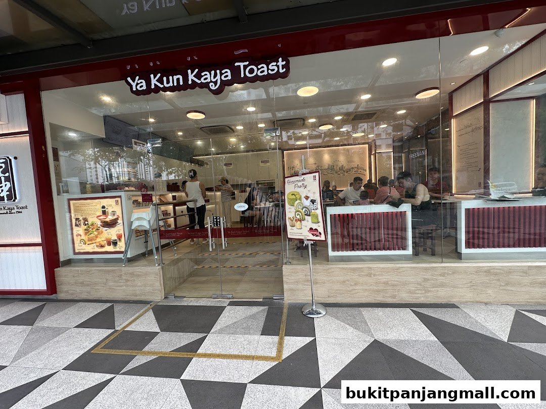 The exterior of Ya Kun Kaya Toast, a popular eatery, showcasing its inviting interior and signage.